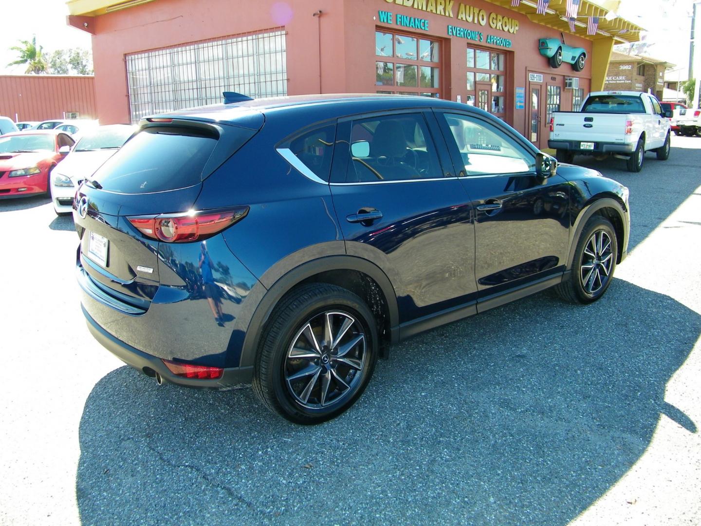 2018 Blue /Black Mazda CX-5 Grand Touring (JM3KFADM8J1) with an 2.5L L4 DOHC 16V engine, 6A transmission, located at 4000 Bee Ridge Road, Sarasota, FL, 34233, (941) 926-0300, 27.298664, -82.489151 - Photo#5